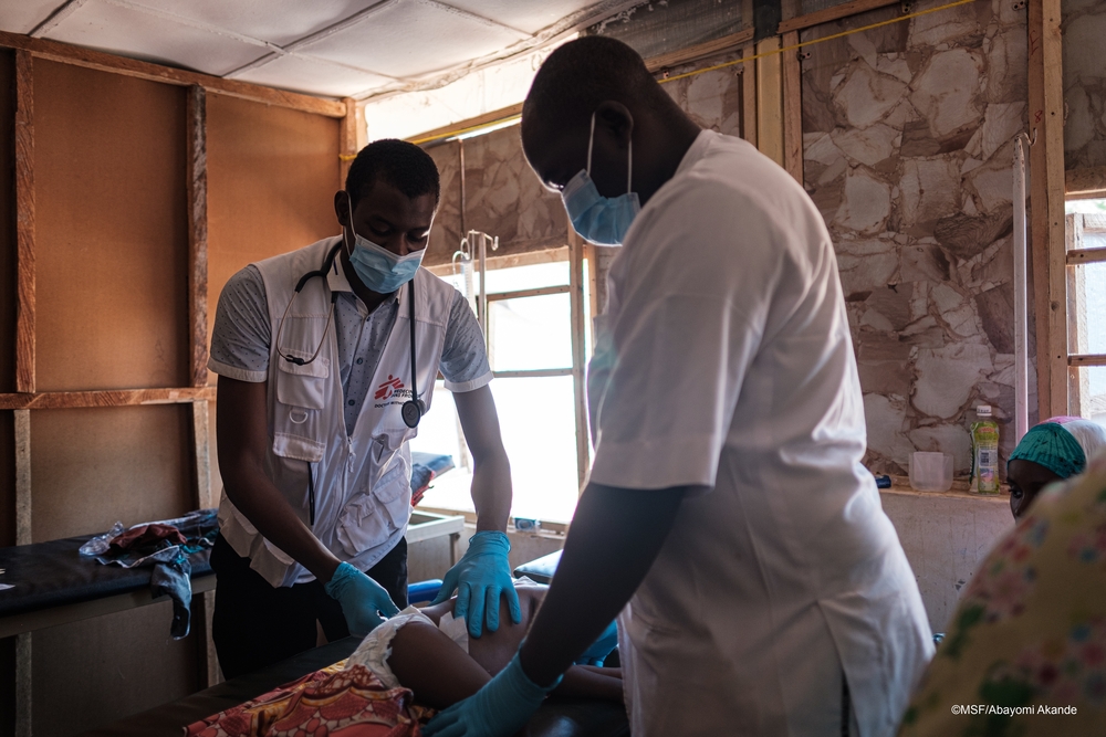 Doctors treating a child in Shinkafi hospital