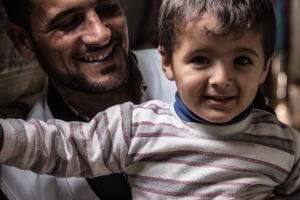 Jasim, MSF Counsellor with his son