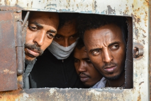 Migrants and refugees in Zintan and Gharyan detention centres in Libya