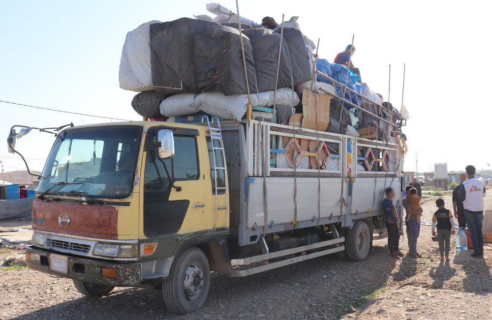 Laylan camp: trucks for belongings