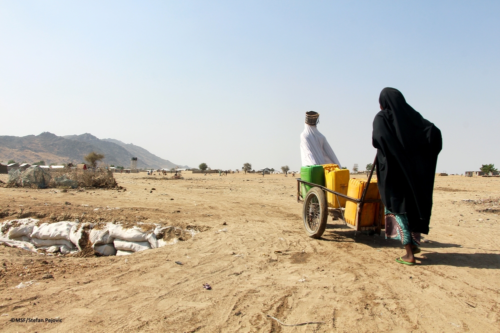 Carrying water from boreholes in Pulka IDP camp