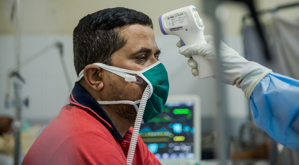 Patient Pramod getting his temperature checked at the HFNC.jpg