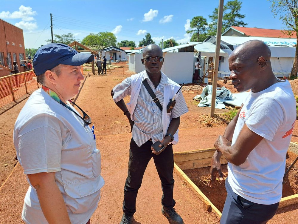 An MSF team discusses plans for a 39-bed Ebola treatment center in Mubindi