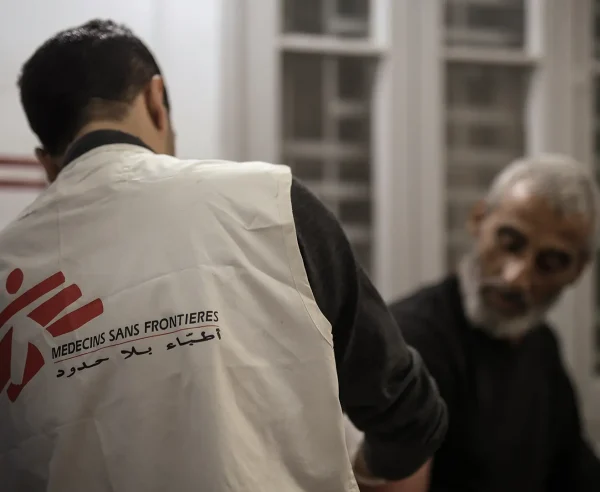 Dr Khaled Al-Shawwa is performing a minor surgery at the MSF clinic in Gaza City. Palestine, December 2024.