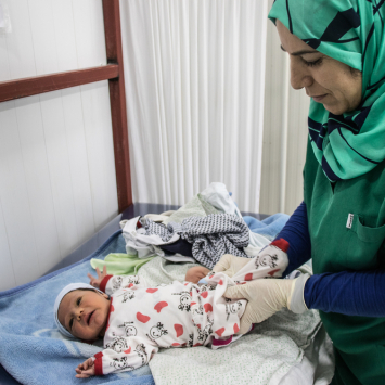 Baby Malik and MSF midwife Layla, Iraq