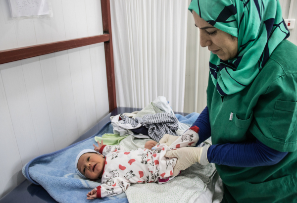 Baby Malik and MSF midwife Layla, Iraq