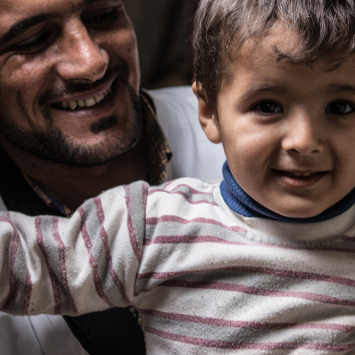 Jasim, MSF Counsellor with his son