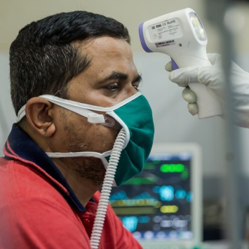 Patient Pramod getting his temperature checked at the HFNC.jpg